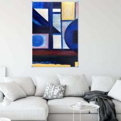 "Abstract Blue, Yellow and Red" original oil painting in a room setting by Devon based artist Catherine Kennedy. Shows blue circles adn squares with yellow rectangle and white triangles and rectangles and a red horizontal line.